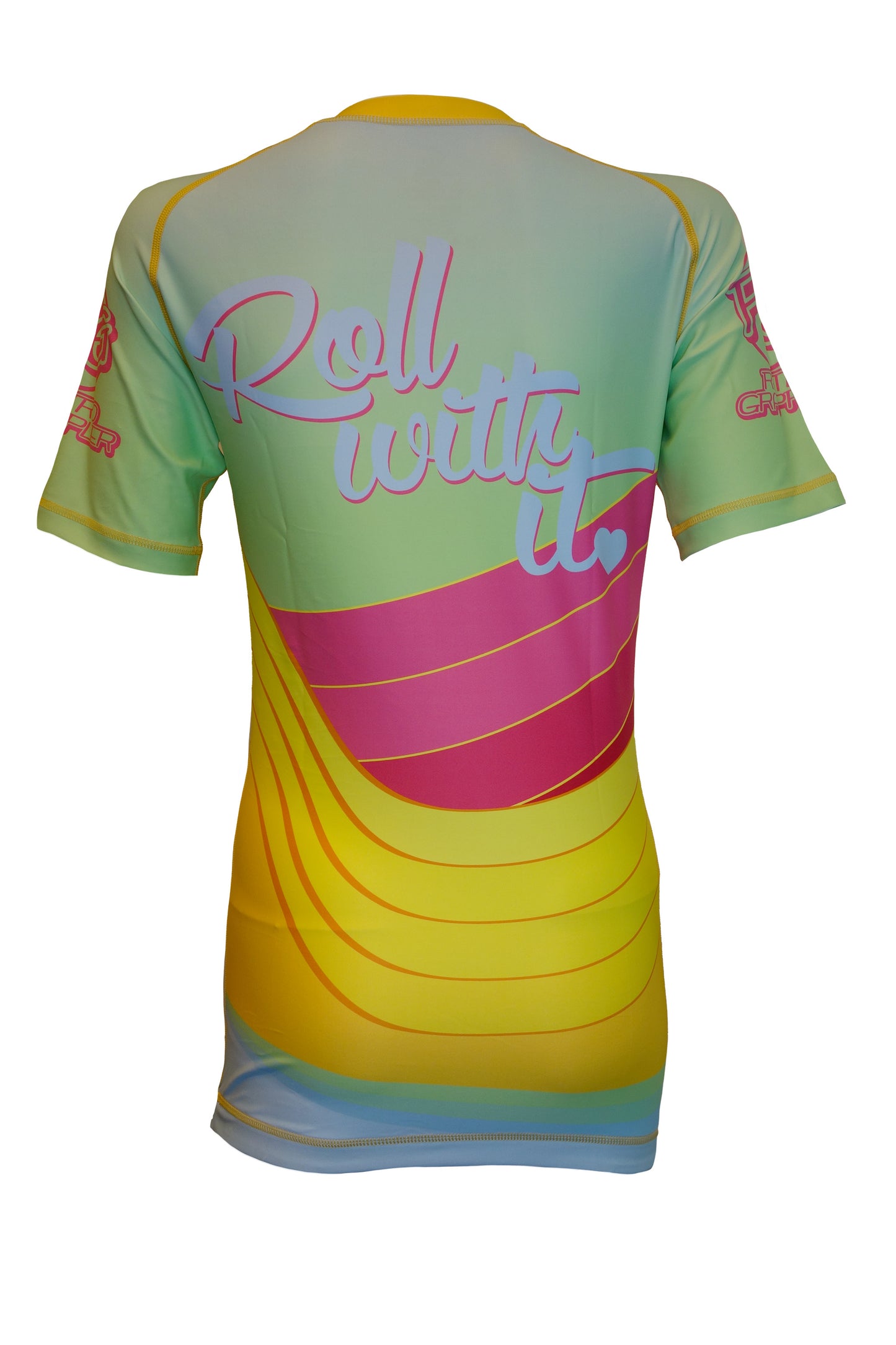 The Retro Grappler Golden Waves BJJ Rash Guard is a short-sleeved top with a pastel yellow, green, and pink gradient. Roll with it stands out on the back above curved pink and yellow stripes and an abstract design.